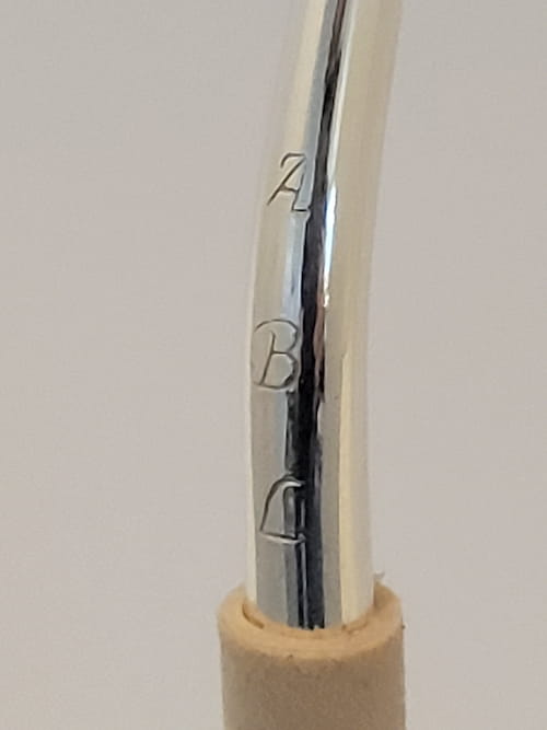 Close up view of Bocal handcrafted by Alex Laubin and engraved with the letters ABL